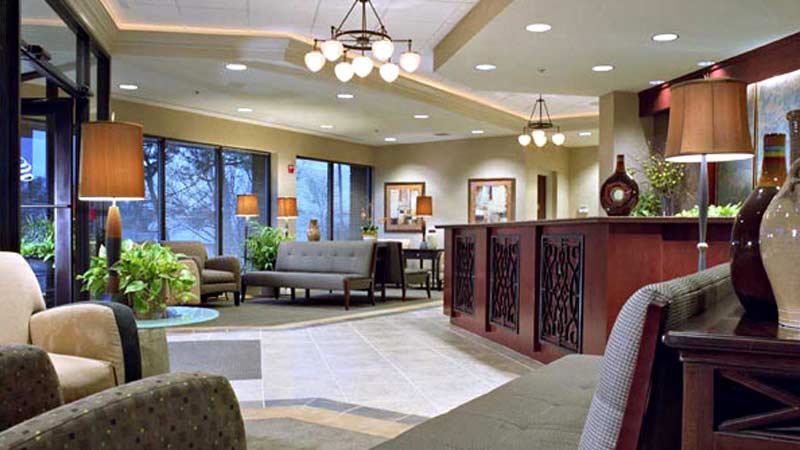 Interior of Office lobby with front desk, couches and seating areas